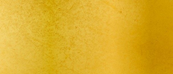 Shiny gold surface as background, closeup view