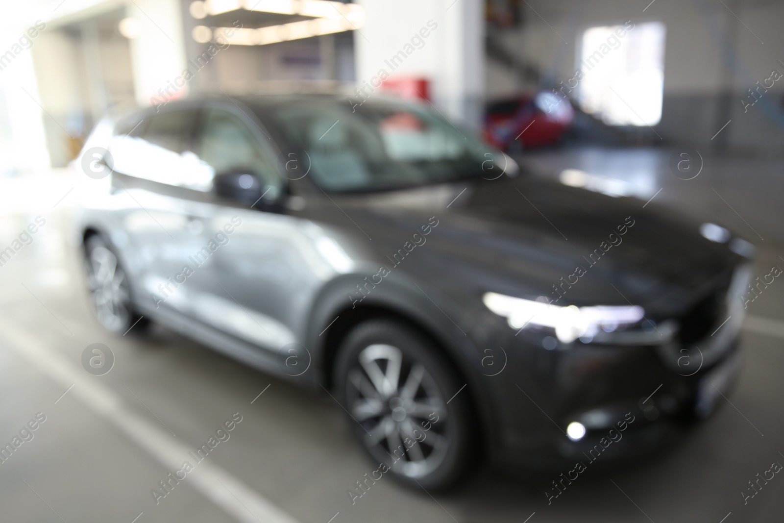 Photo of Blurred view of automobile at professional car wash service