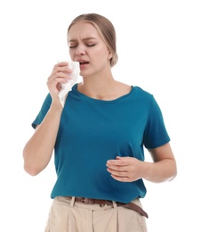 Young woman suffering from allergy on white background