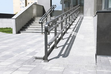 Photo of Outdoor stairs with ramp and metal railing
