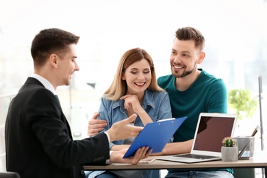 Young couple meeting with consultant in office