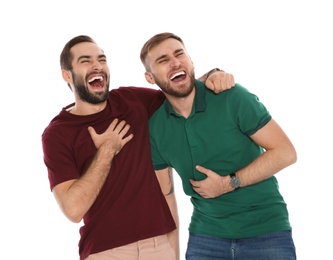Photo of Portrait of young men laughing on white background