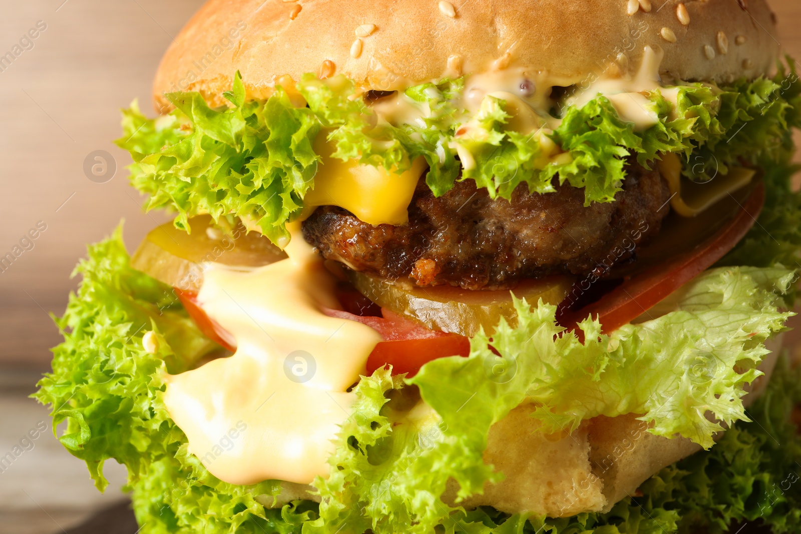 Burger with delicious patty on table, closeup Photo of Burger with delicious patty on table, closeup