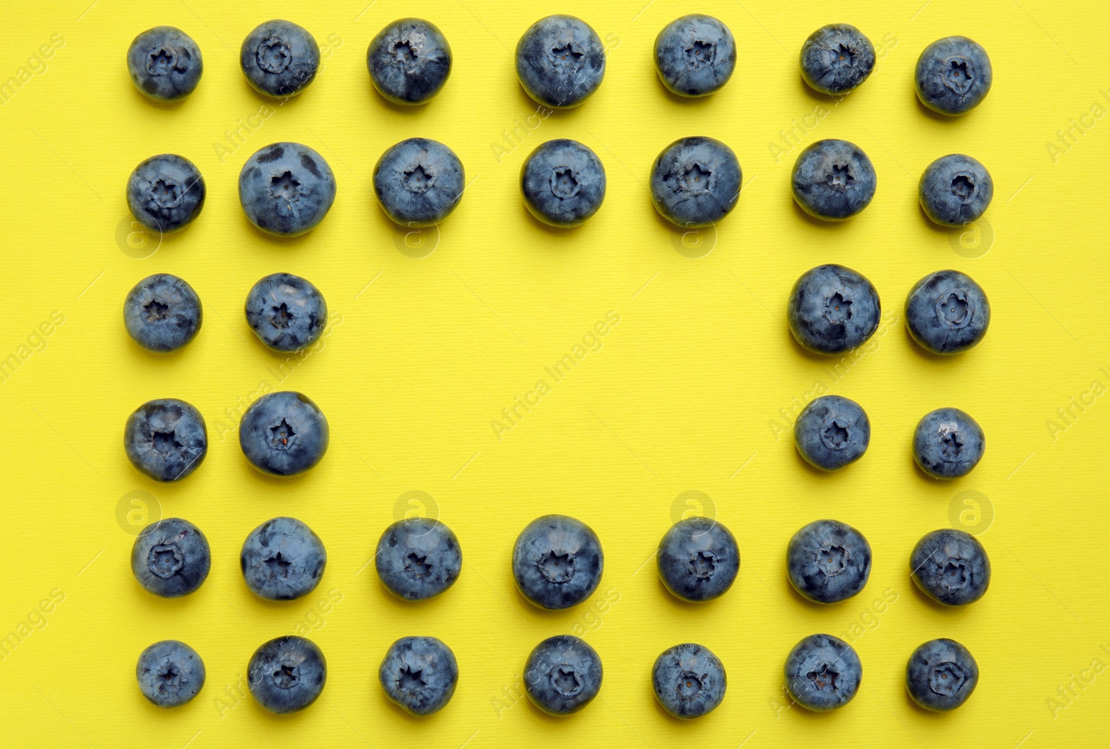 Photo of Flat lay composition with tasty blueberry and space for text on color background