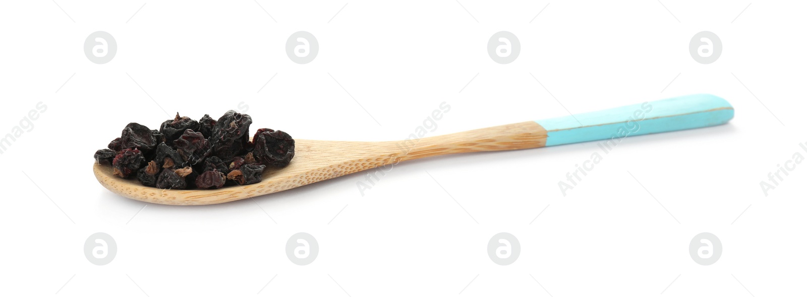 Photo of Dried black currants in wooden spoon isolated on white