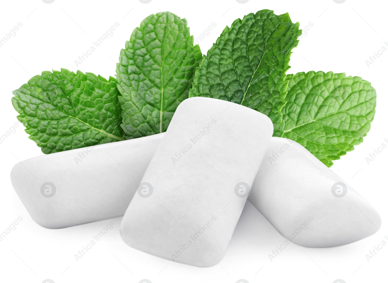 Image of Menthol chewing gum pillows and mint leaves on white background