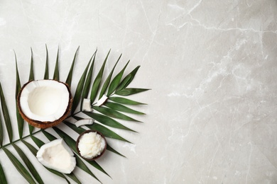 Photo of Flat lay composition with coconut oil on grey background. Healthy cooking