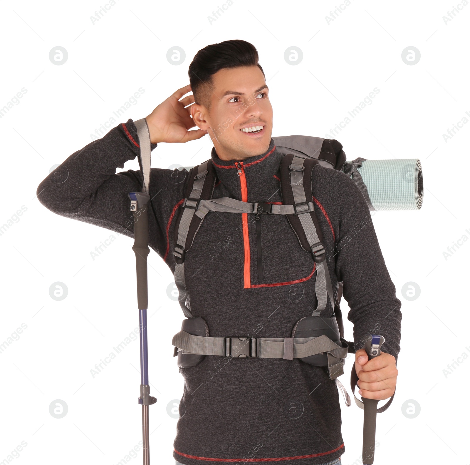 Photo of Male hiker with backpack and trekking poles on white background