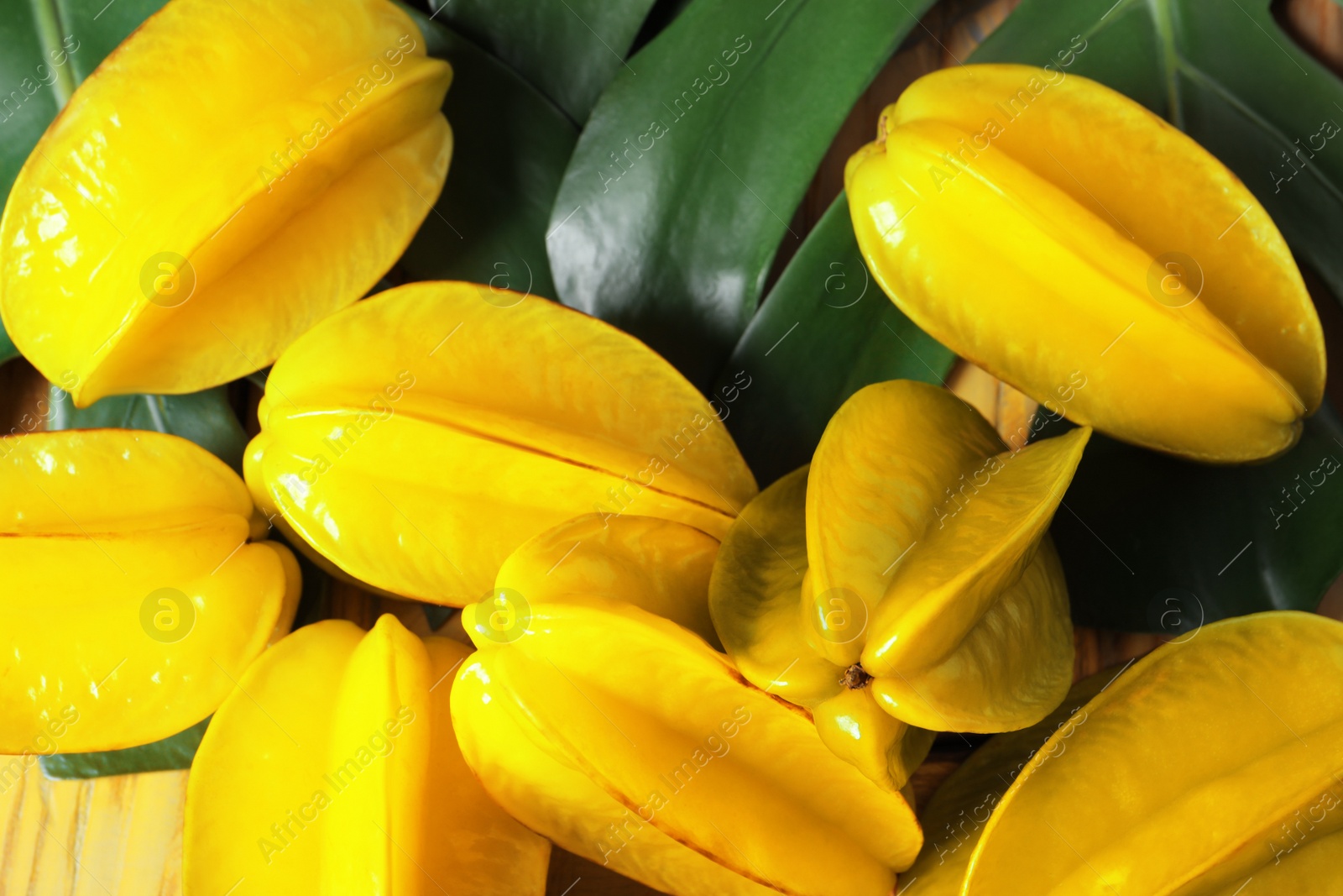 Photo of Delicious carambola fruits on table, flat lay