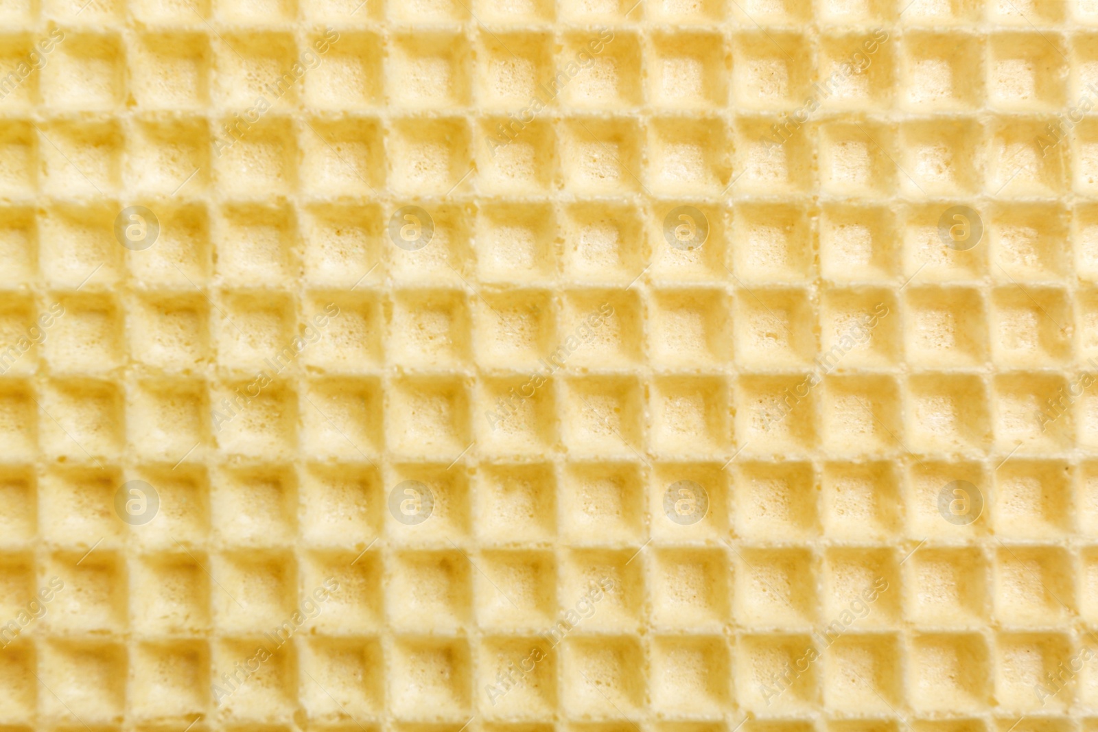 Photo of Tasty wafer as background, closeup. Crispy food