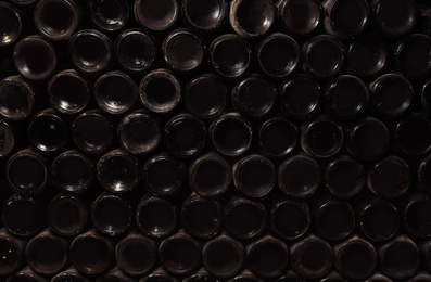 Photo of Bottoms of wine bottles as background, closeup