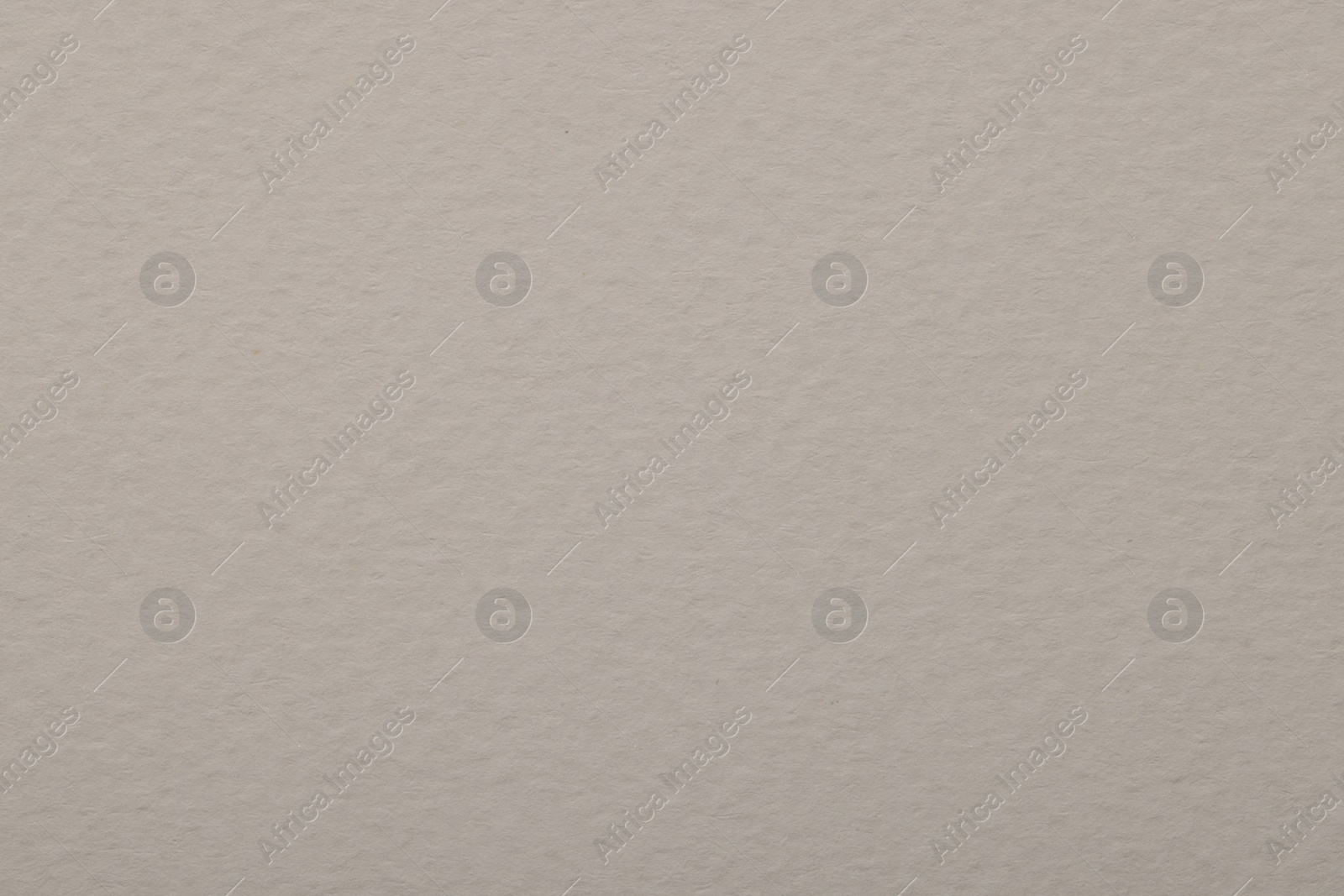 Photo of Texture of light grey paper sheet as background, top view