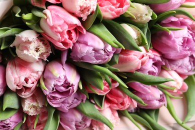 Photo of Beautiful bouquet of tulips as background, closeup