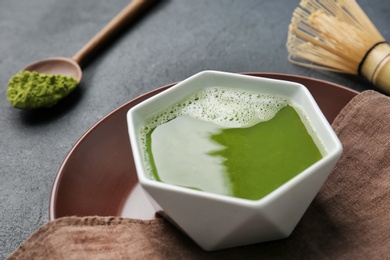 Chawan with fresh matcha tea on table