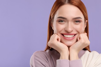 Photo of Beautiful woman with clean teeth smiling on violet background, space for text