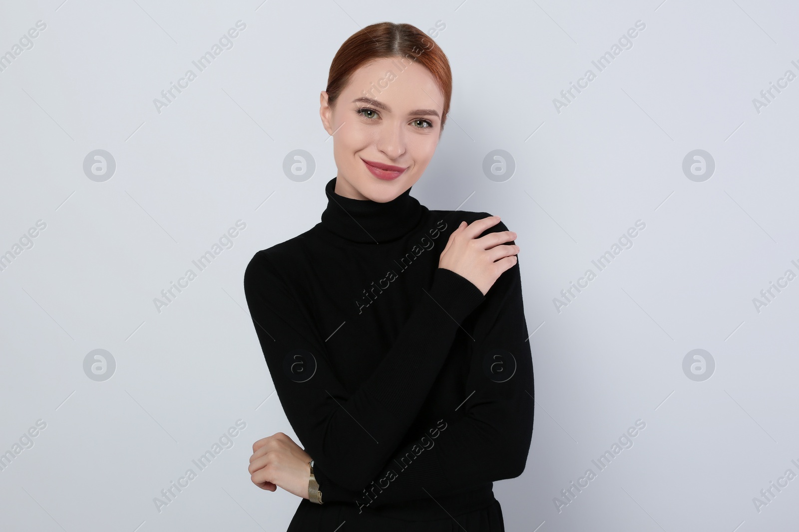 Photo of Portrait of beautiful young woman on light gray background