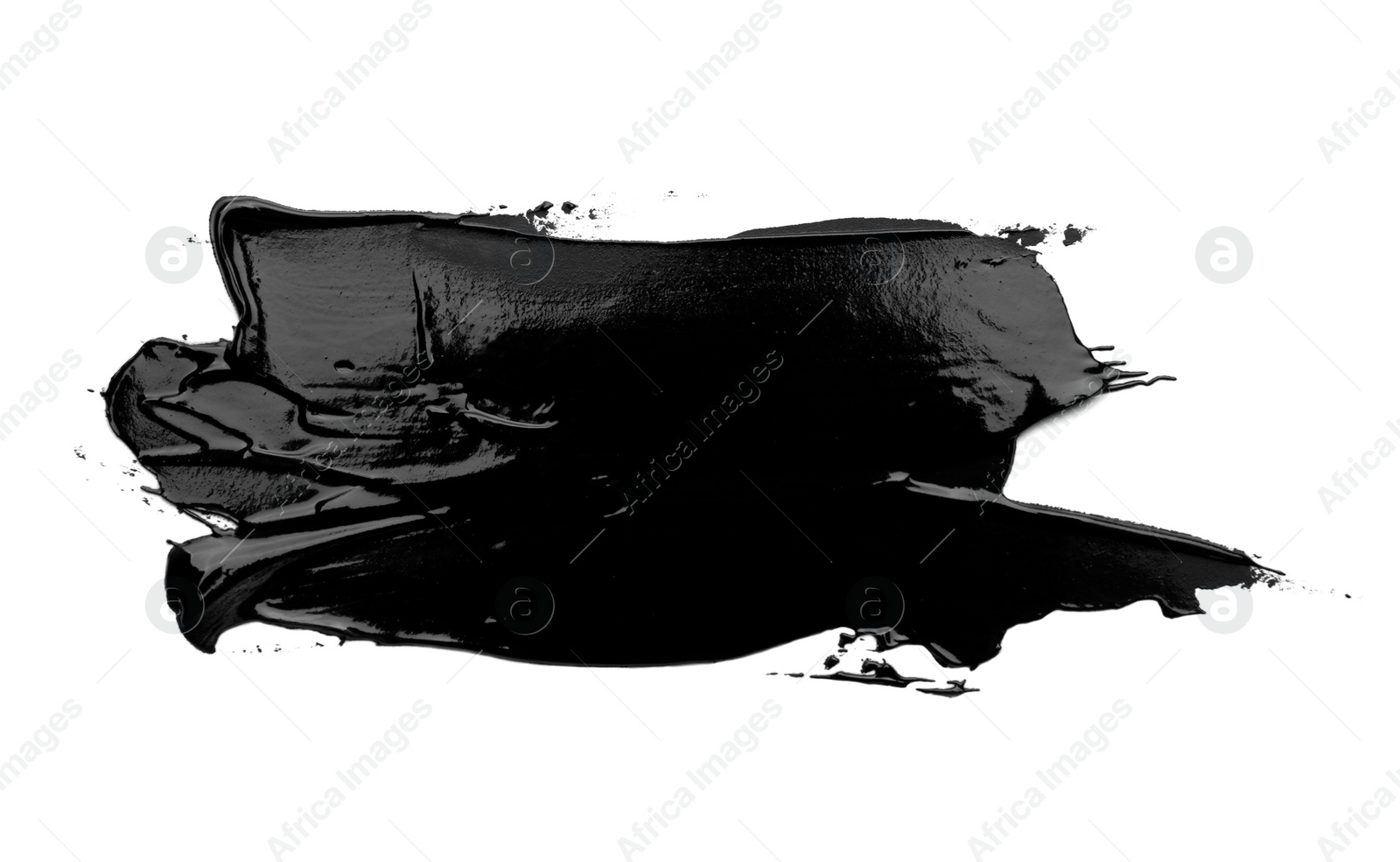 Photo of Black oil paint stroke on white background, top view