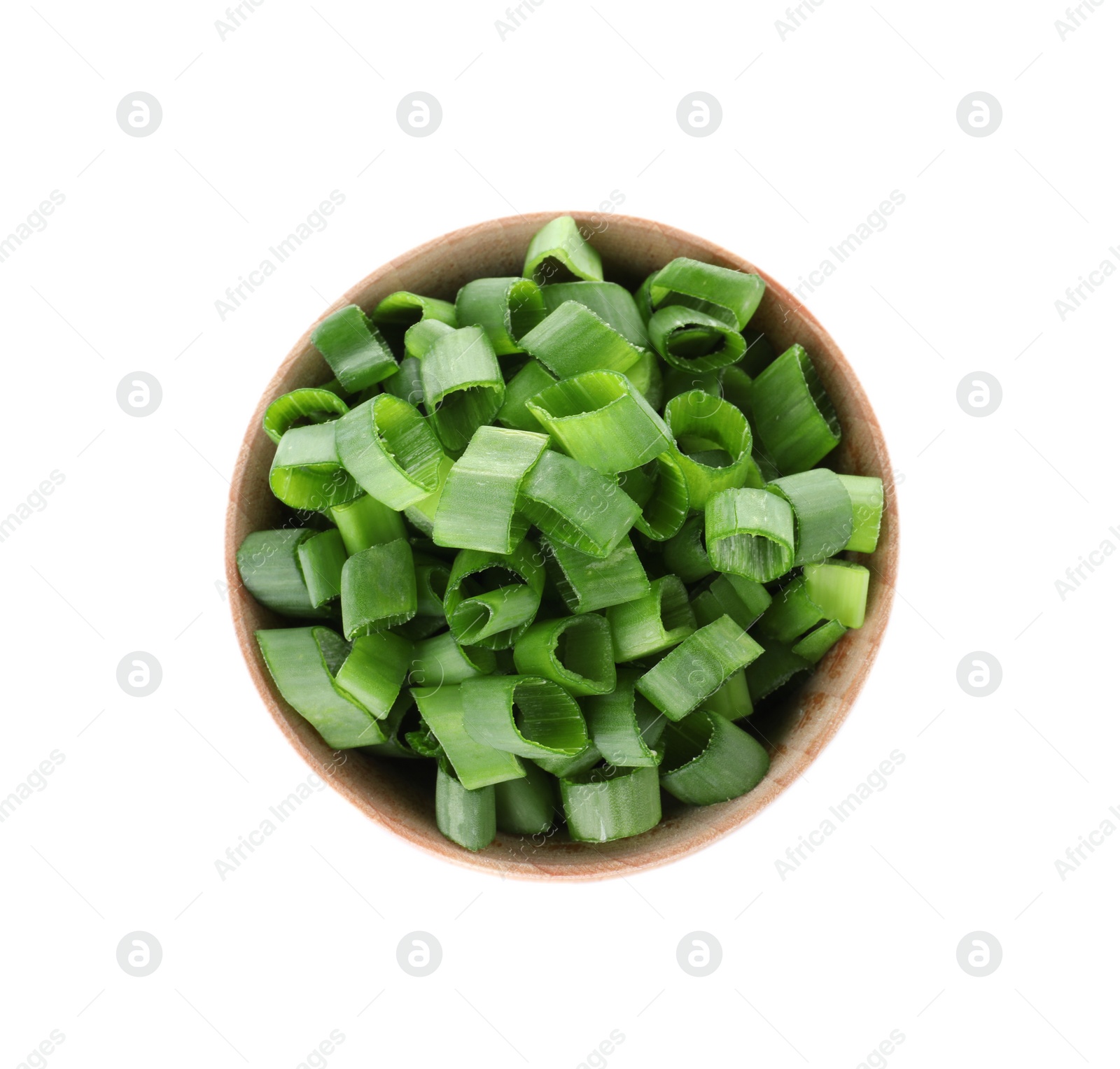 Photo of Wooden bowl of cut green onion on white background, top view