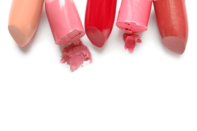 Photo of Different lipstick swatches on white background, top view