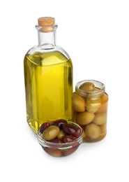 Photo of Vegetable fats. Bottle of cooking oil and olives isolated on white