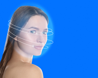 Image of Facial recognition system. Woman scanned by digital biometric grid on blue background