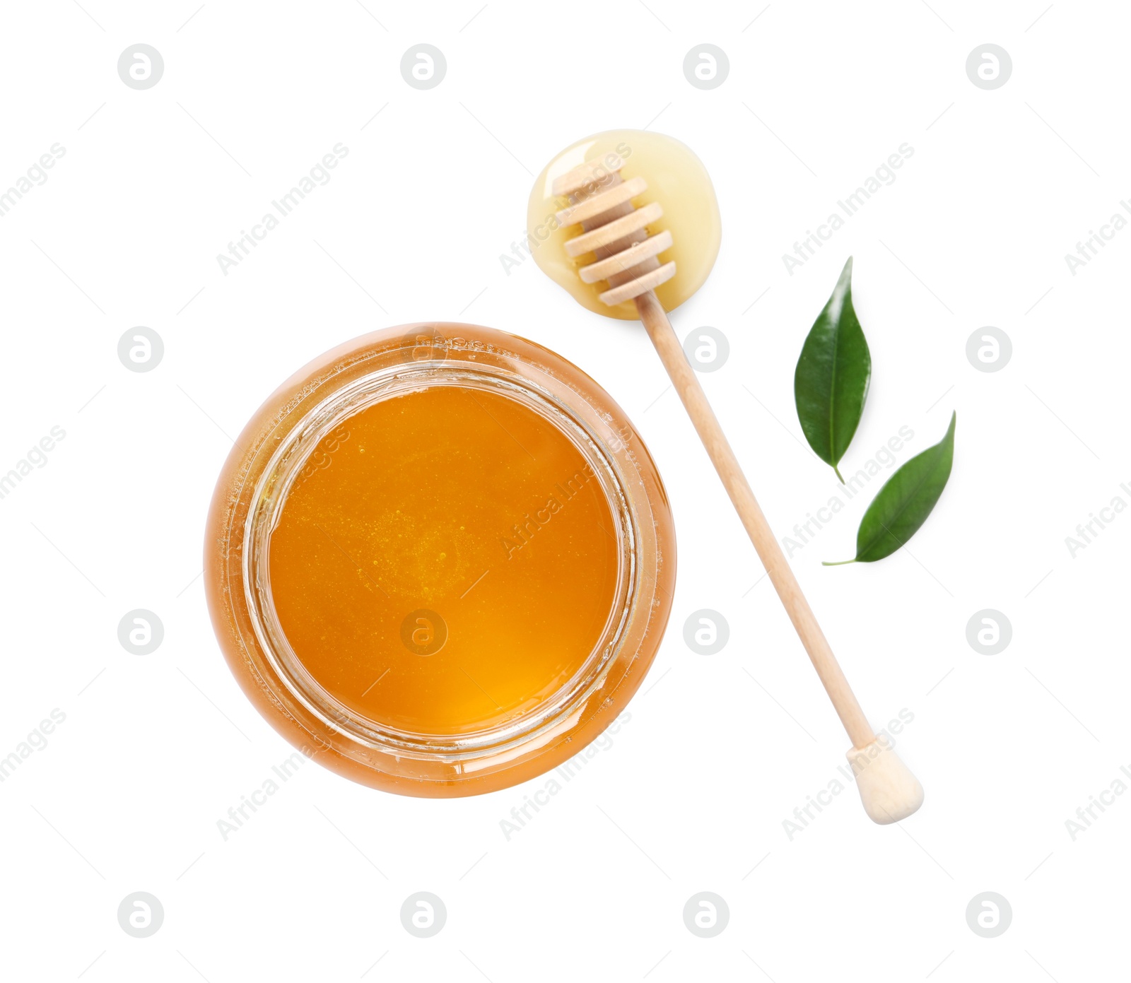 Photo of Tasty honey in glass jar, dipper and leaves isolated on white, top view. Space for text