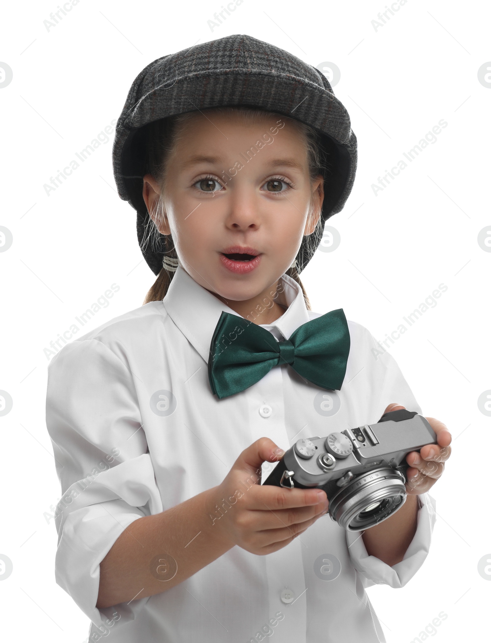 Photo of Cute little detective with vintage camera on white background