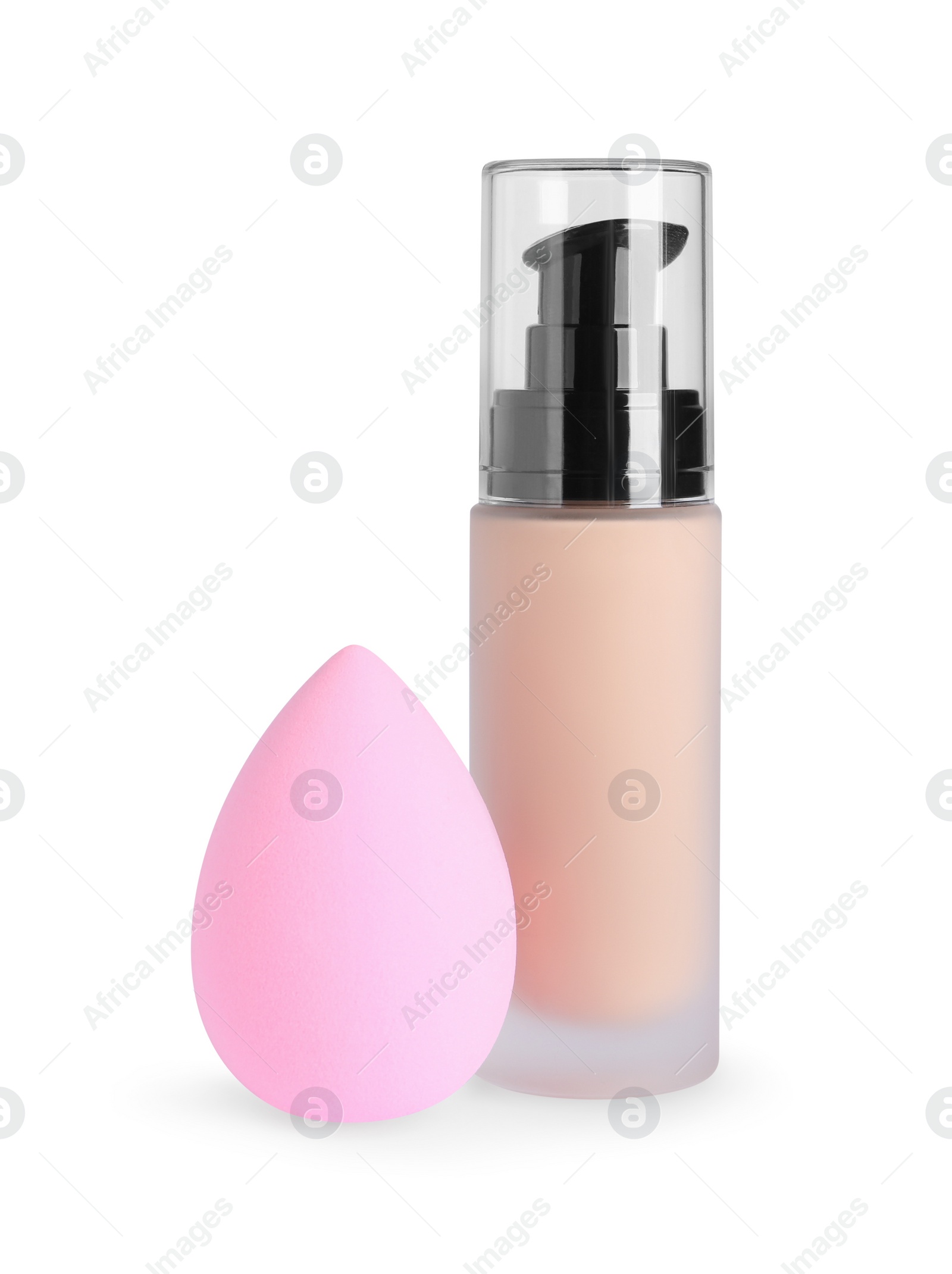 Photo of Bottle of skin foundation and sponge on white background. Makeup product