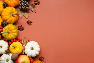 Photo of Thanksgiving day. Flat lay composition with pumpkins on brown background, space for text