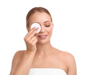 Photo of Beautiful young woman with cotton pad on white background