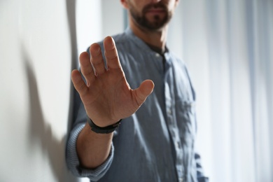 Photo of Man reaching for something, closeup of hand. Help and support concept