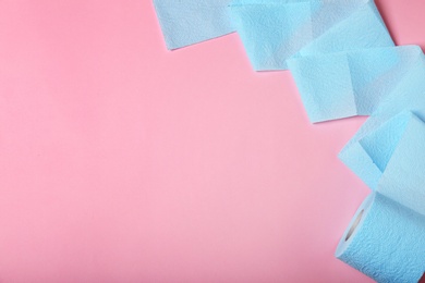 Photo of Roll of toilet paper on color background, top view. Space for text