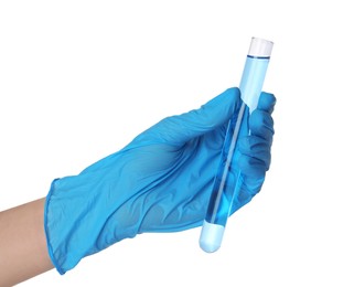 Photo of Scientist in gloves holding test tube with light blue liquid on white background, closeup