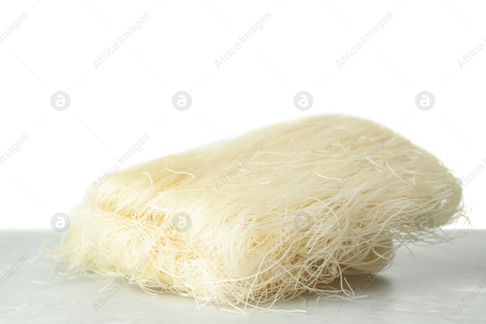 Photo of Block of rice noodles on light grey marble table, closeup