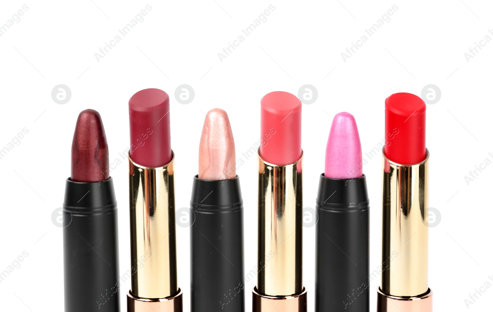 Photo of Set of colorful lipsticks isolated on white