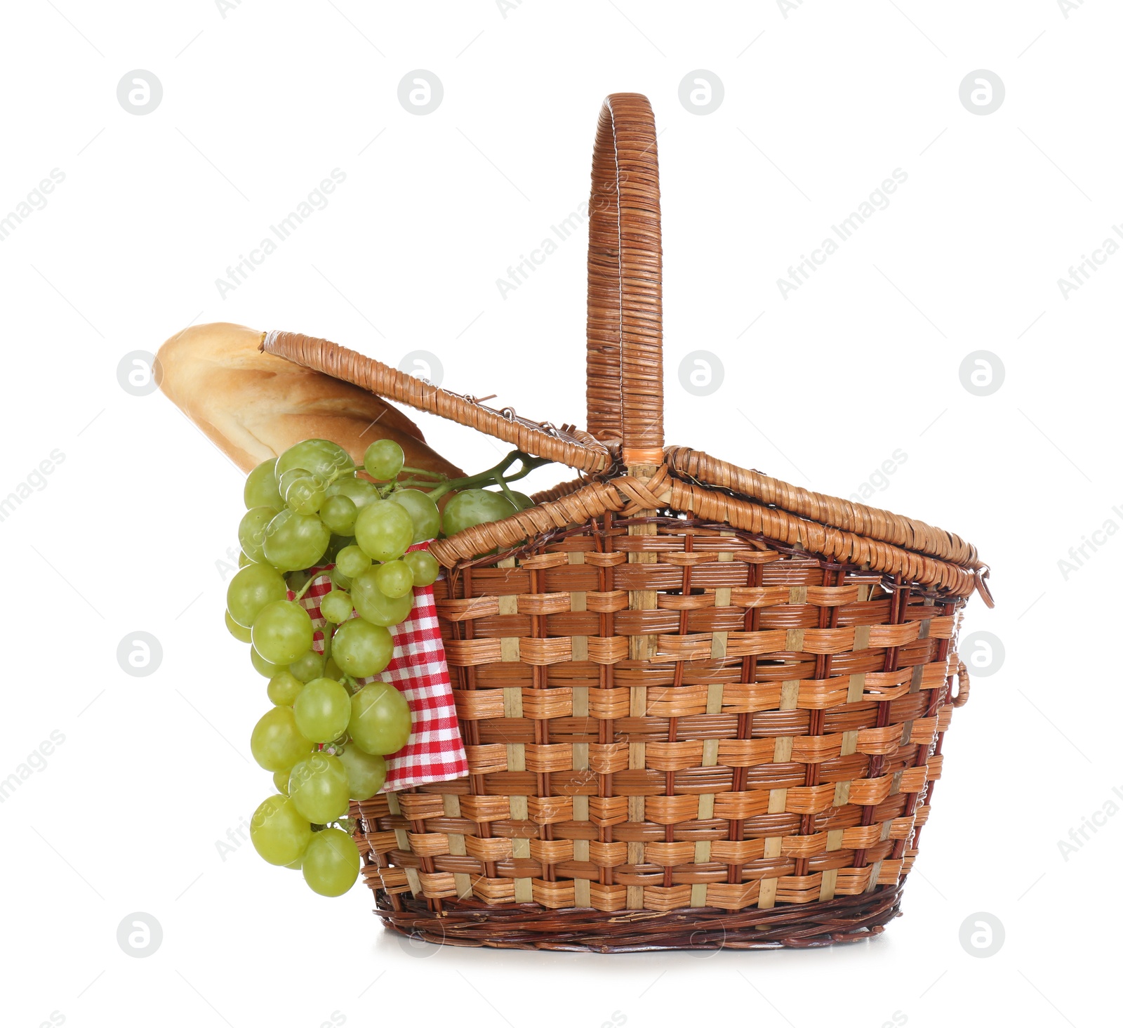 Photo of Wicker basket for picnic filled with food on white background