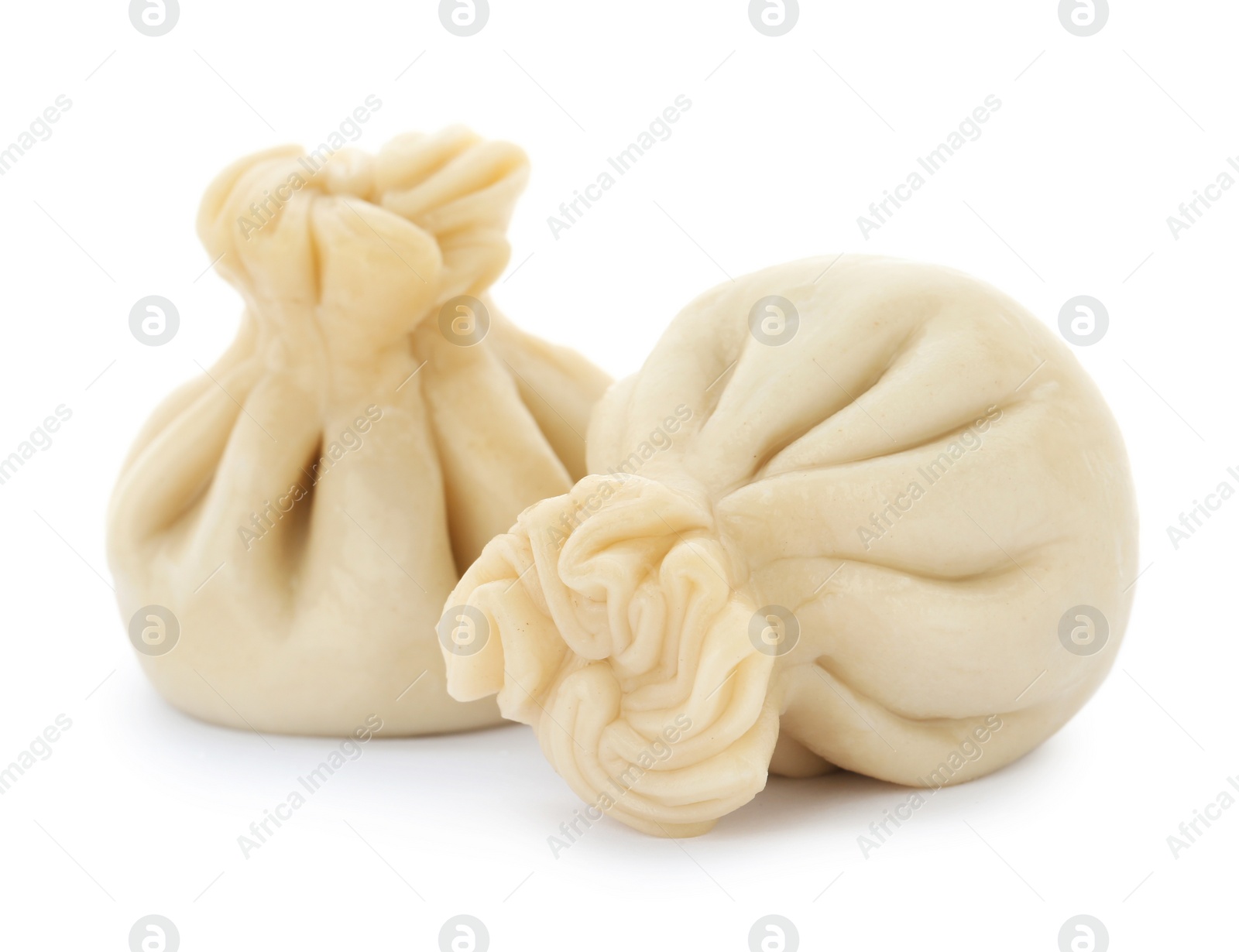 Photo of Boiled dumplings with tasty filling on white background