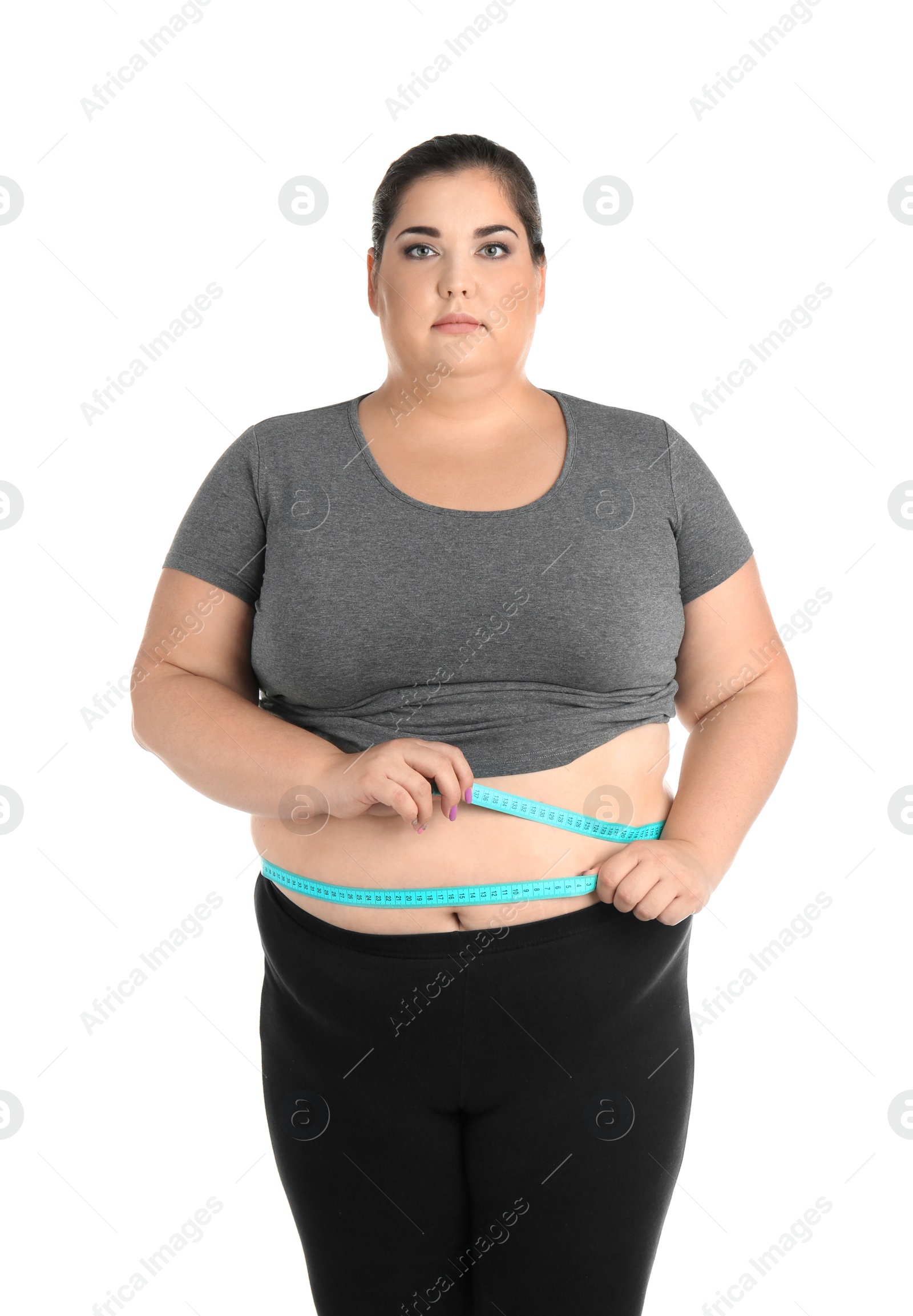 Photo of Overweight woman with measuring tape on white background