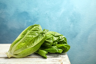 Photo of Fresh ripe cos lettuce on wooden table