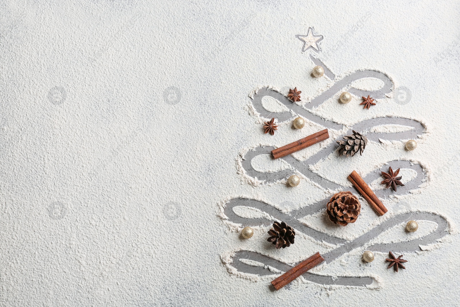 Photo of Christmas tree made of flour and festive decor on grey table, flat lay. Space for text