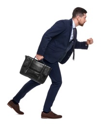 Photo of Handsome bearded businessman in suit with briefcase on white background