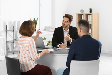 Human resources manager conducting job interview with applicants in office