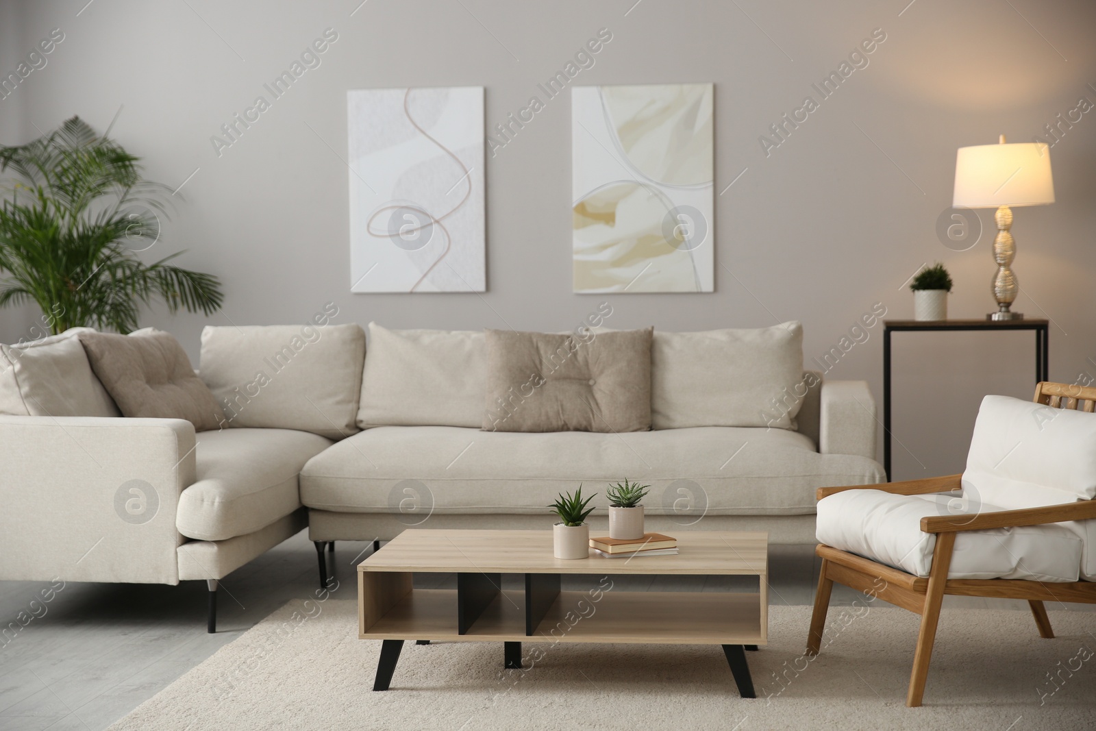 Photo of Big comfortable sofa in living room. Interior design