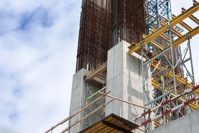 Photo of Unfinished building on construction site, low angle view