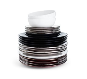 Photo of Stack of beautiful ceramic plates and bowls isolated on white