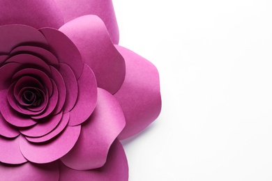 Beautiful pink flower made of paper on white background, top view