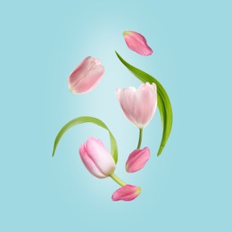 Image of Beautiful pink tulips flying on turquoise background