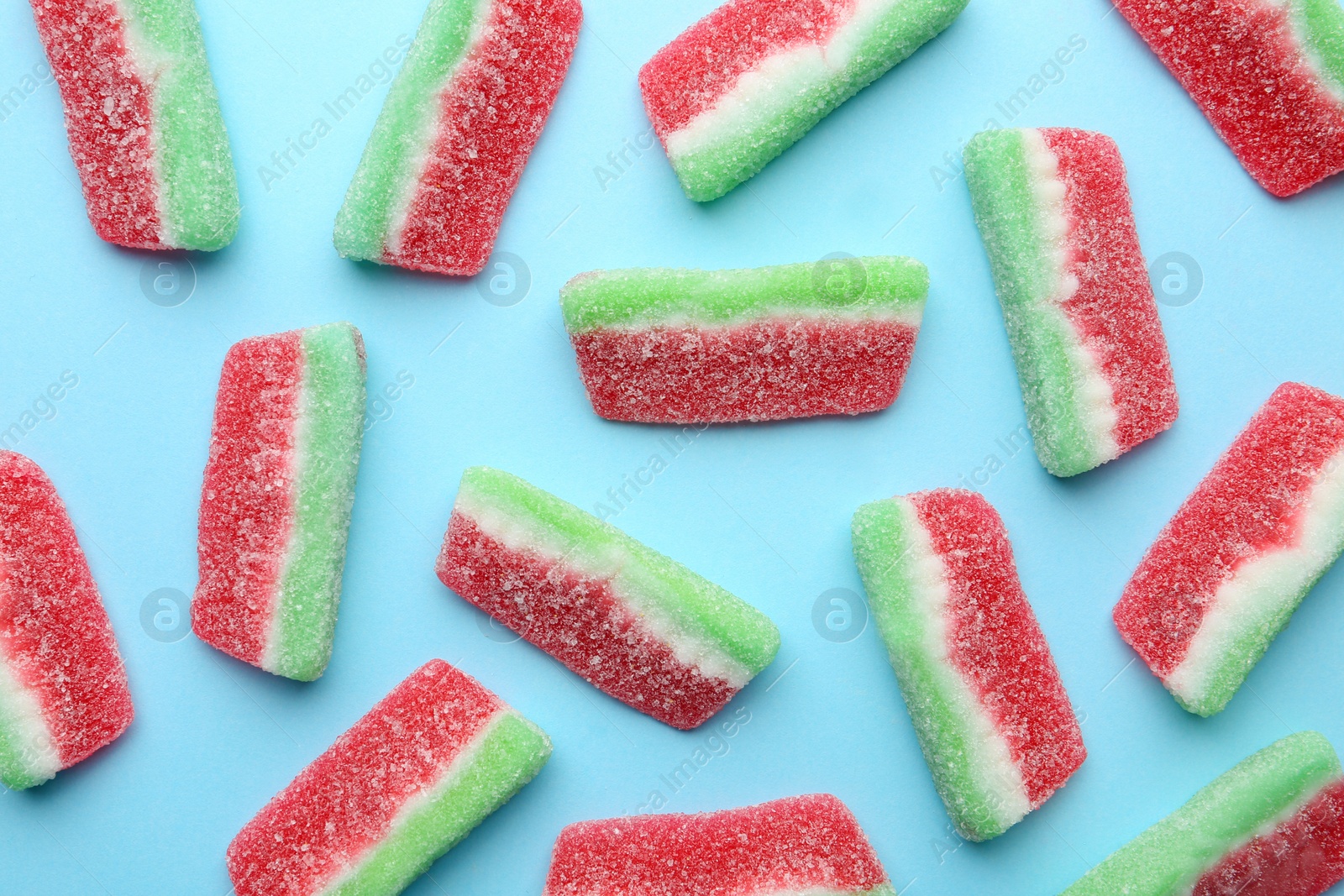 Photo of Tasty jelly candies on color background, top view