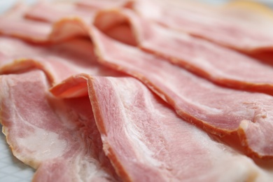 Photo of Slices of fresh raw bacon, closeup view