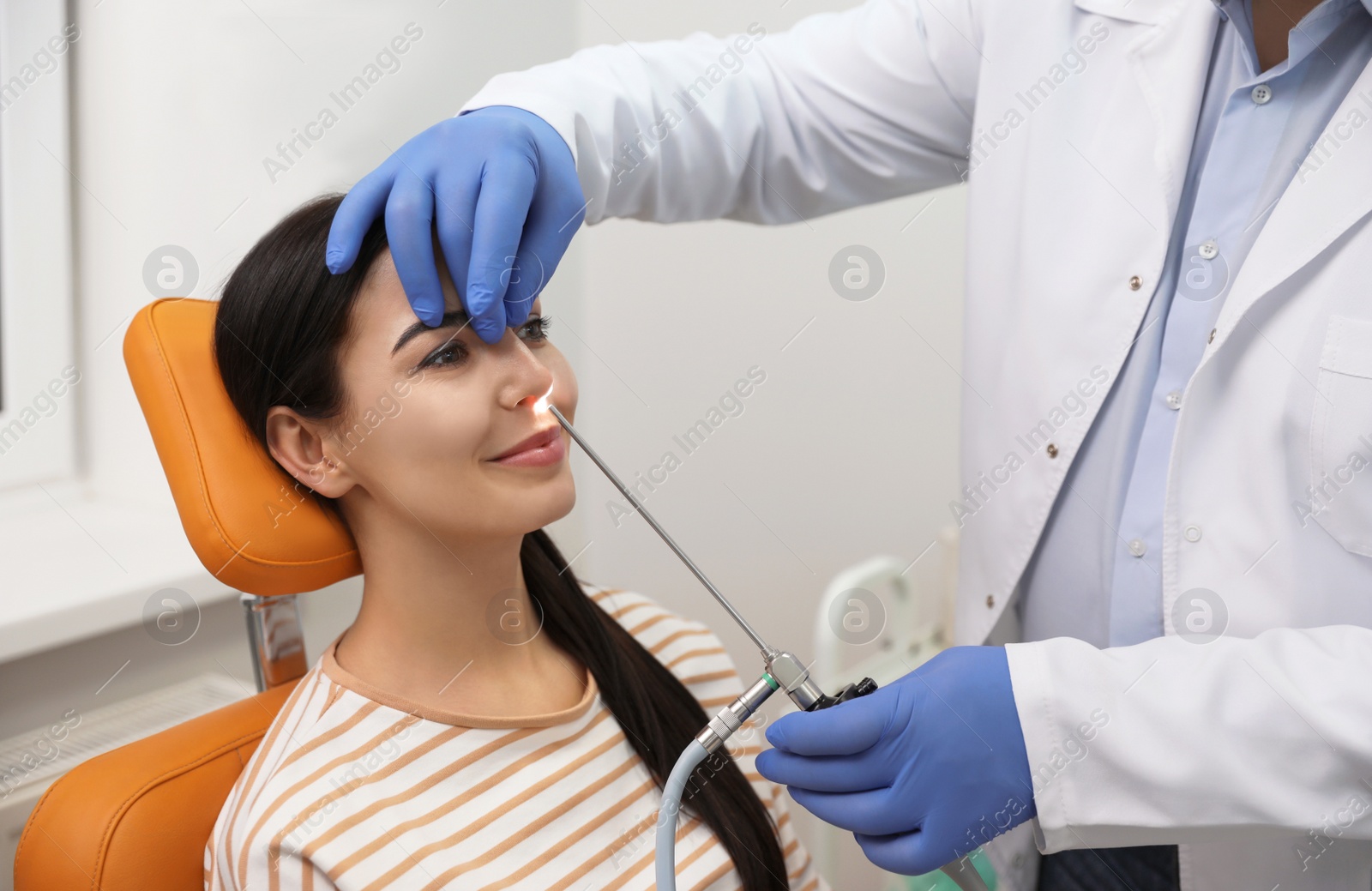 Photo of Professional doctor examining patient before surgery in clinic
